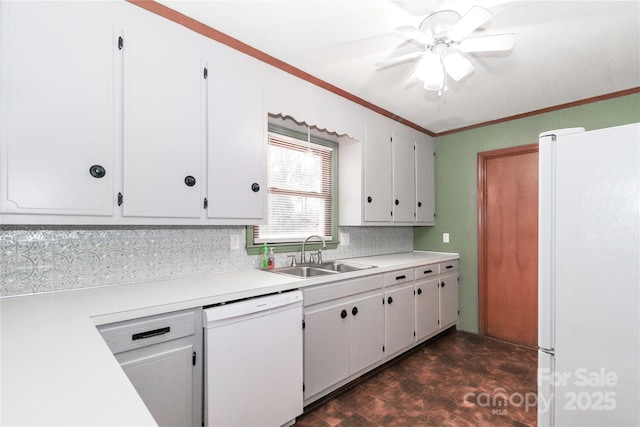 kitchen featuring backsplash, white appliances, ornamental molding, white cabinets, and sink