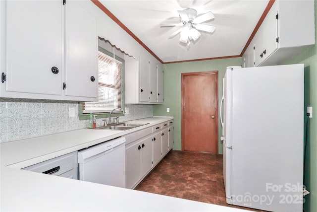 kitchen featuring tasteful backsplash, sink, crown molding, white appliances, and white cabinets