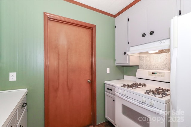 kitchen with white appliances and white cabinetry