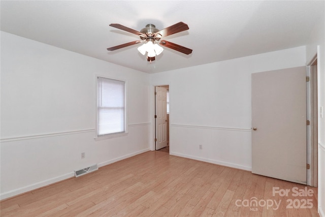 unfurnished room featuring ceiling fan and light hardwood / wood-style flooring