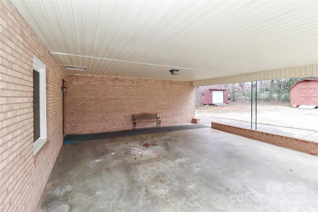 view of patio / terrace with a shed