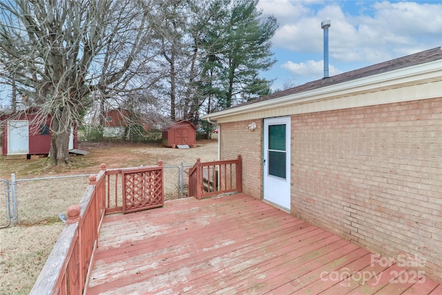 wooden deck featuring a storage shed