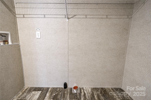 laundry room with hookup for a washing machine and dark wood-type flooring