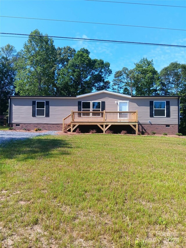 1245 Cleveland Ave, Grover, NC 28073 - manufactured / mobile home with a deck, crawl space, and a front lawn