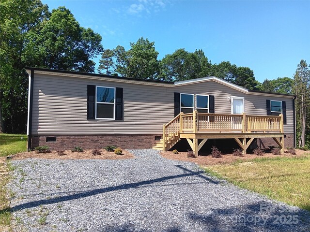 1245 Cleveland Ave, Grover, NC 28073 - manufactured / mobile home with crawl space and a wooden deck
