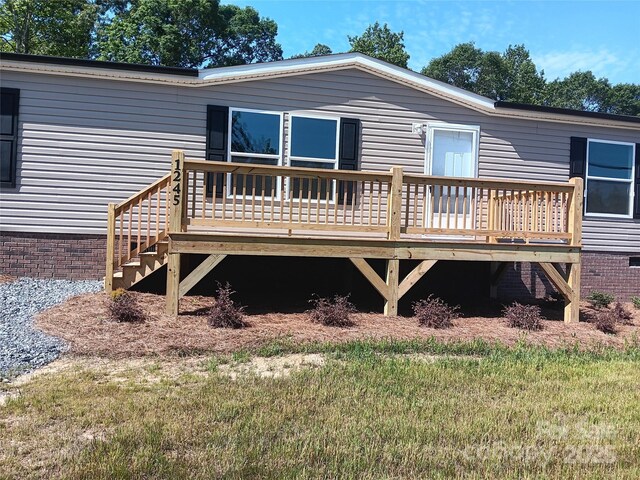 1245 Cleveland Ave, Grover, NC 28073 - rear view of property with crawl space and a wooden deck