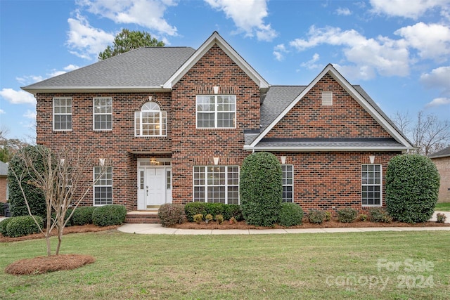 view of front of property with a front lawn