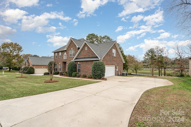 front of property with a garage and a front yard