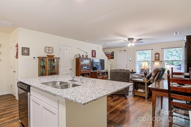 kitchen with dark hardwood / wood-style flooring, white cabinetry, sink, and black dishwasher