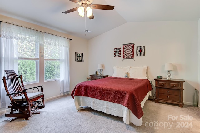 carpeted bedroom with lofted ceiling and ceiling fan