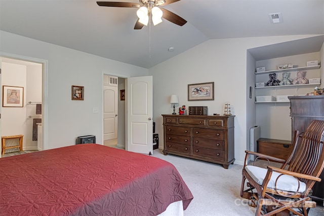 carpeted bedroom featuring vaulted ceiling, ceiling fan, and ensuite bathroom