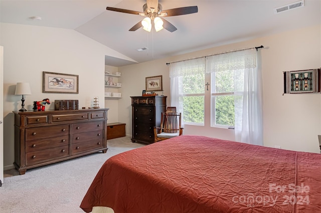 carpeted bedroom featuring ceiling fan and vaulted ceiling