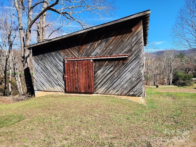 view of outdoor structure with a lawn