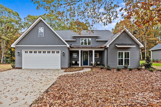 view of front of home with a garage and a porch