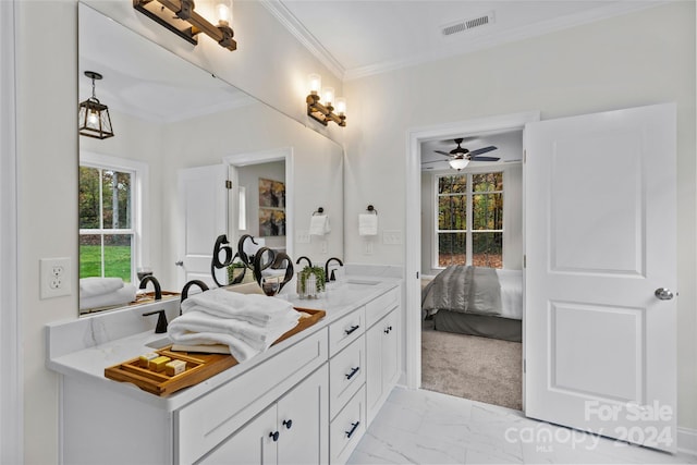 bathroom with ornamental molding, vanity, and ceiling fan