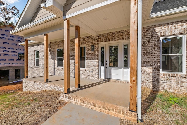 entrance to property with covered porch