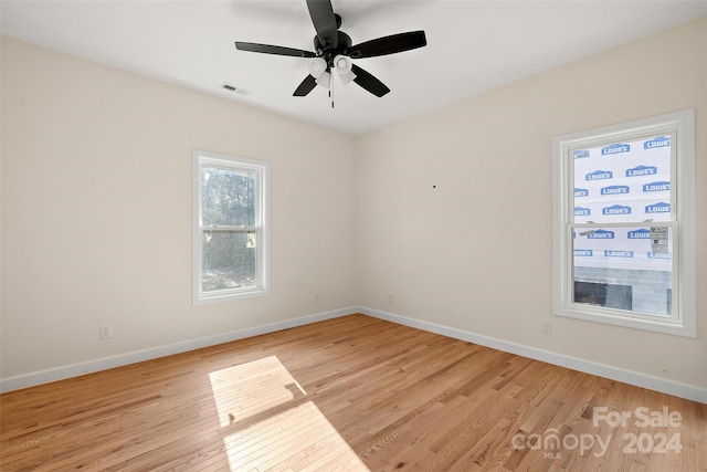 empty room with light hardwood / wood-style floors and ceiling fan