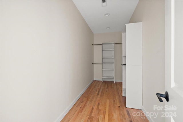 hallway with light wood-type flooring