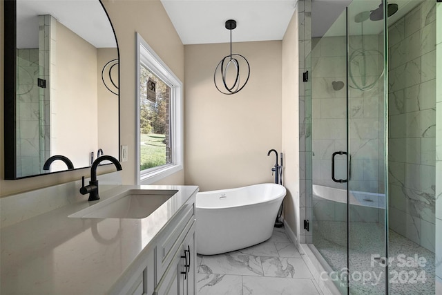 bathroom with vanity and independent shower and bath