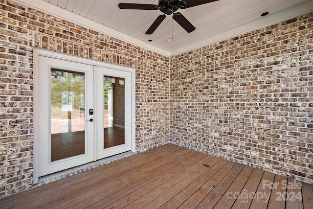 deck with french doors and ceiling fan