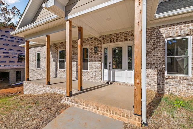 property entrance featuring a porch