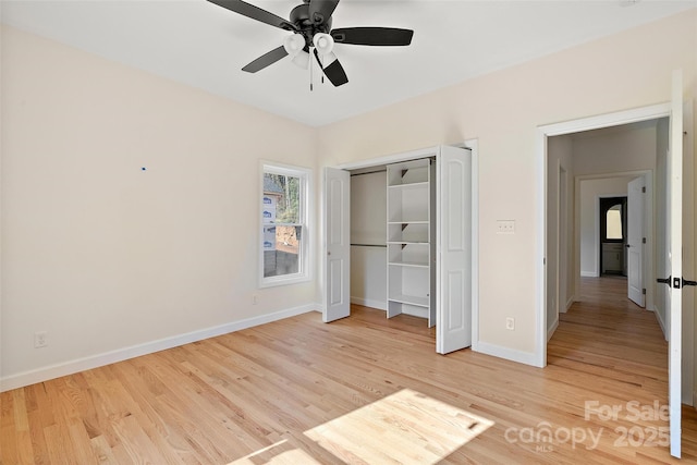 unfurnished bedroom with ceiling fan, light hardwood / wood-style floors, and a closet