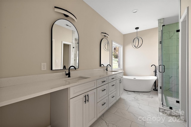 bathroom featuring vanity and shower with separate bathtub