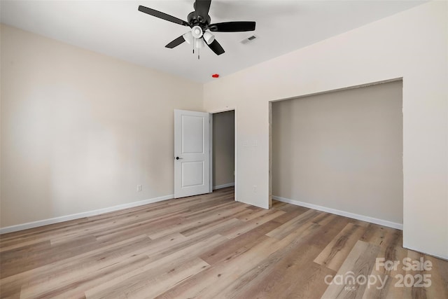 unfurnished bedroom featuring light hardwood / wood-style flooring, a closet, and ceiling fan