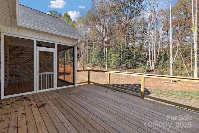 wooden terrace featuring a sunroom