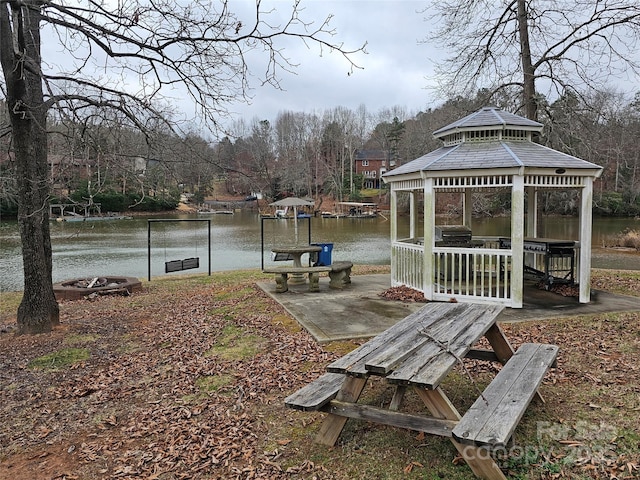 exterior space with a gazebo and a water view