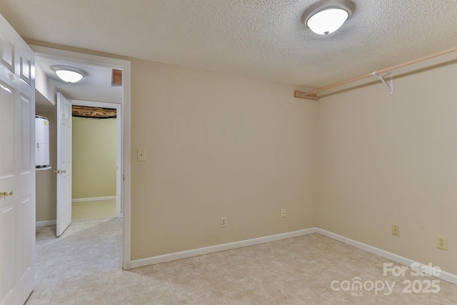 empty room featuring a textured ceiling