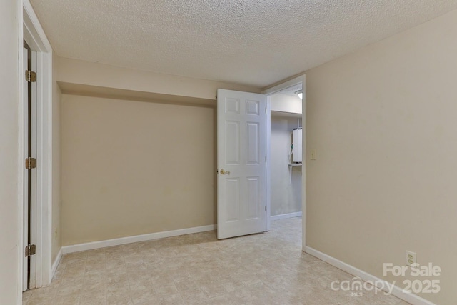 interior space with a textured ceiling