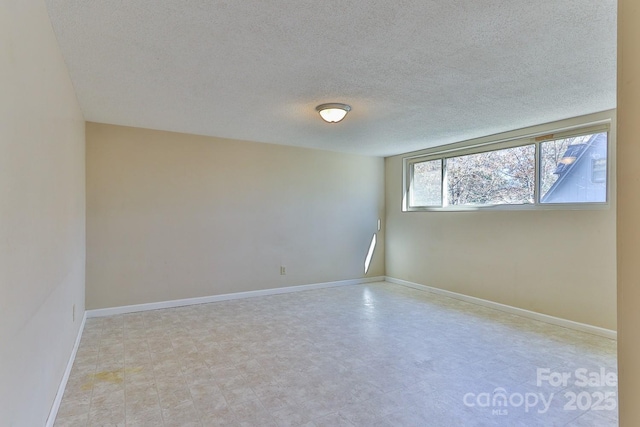 empty room with a textured ceiling