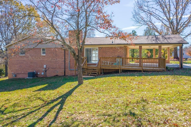 back of house with a deck, central air condition unit, and a lawn