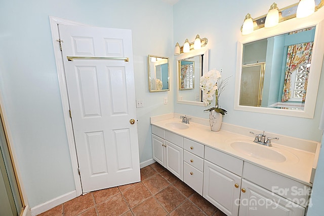 bathroom featuring vanity, tile patterned floors, and an enclosed shower