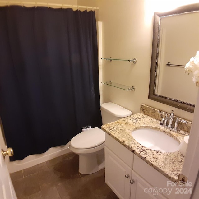 bathroom with tile patterned floors, vanity, toilet, and a shower with shower curtain