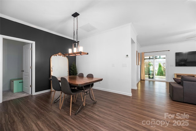 dining area with crown molding and dark hardwood / wood-style floors