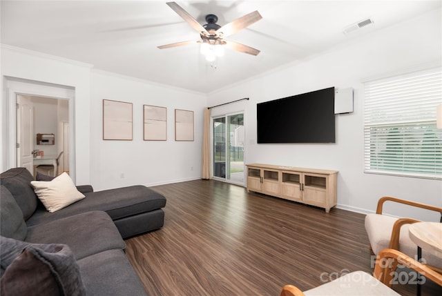 living room featuring ornamental molding, ceiling fan, and dark hardwood / wood-style floors