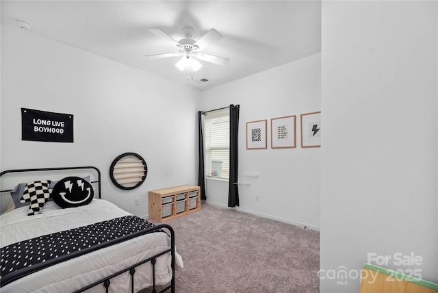 bedroom with ceiling fan and light colored carpet