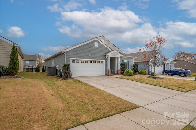 view of front of house featuring central AC, a front yard, and a garage