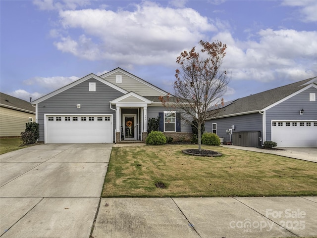 ranch-style home with a garage and a front lawn