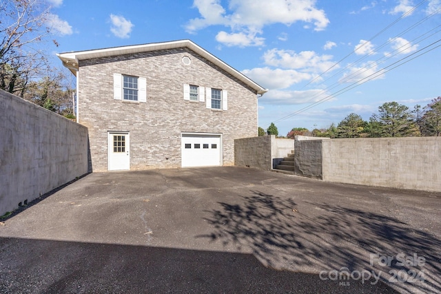 view of side of property with a garage