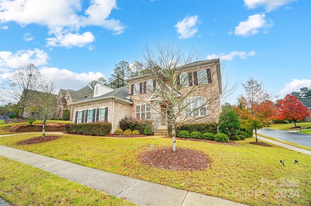 view of front of home with a front lawn