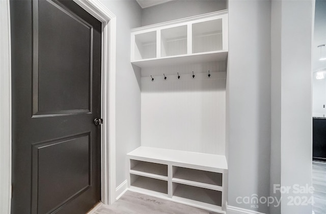 mudroom with light hardwood / wood-style floors