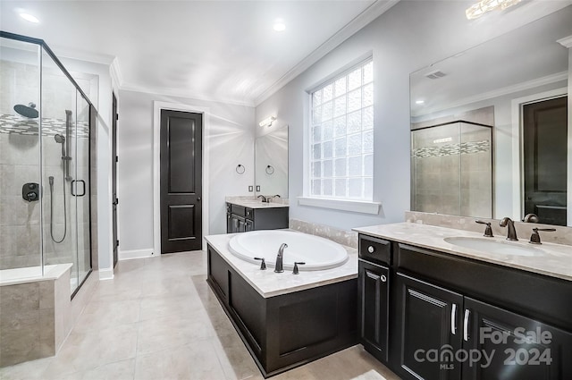 bathroom featuring tile patterned floors, crown molding, vanity, and shower with separate bathtub