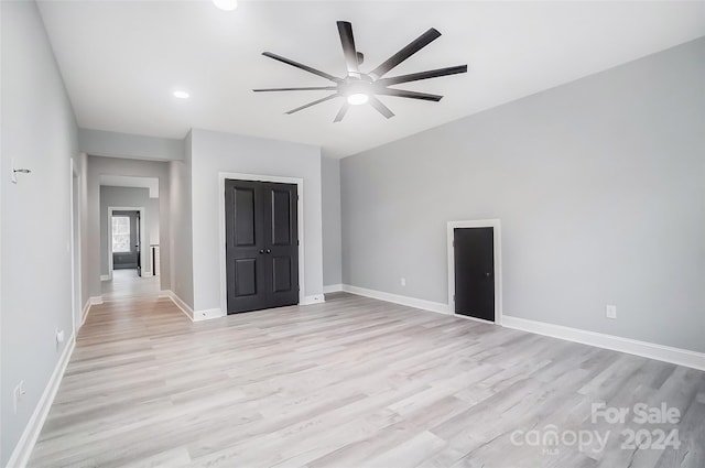 spare room featuring ceiling fan and light hardwood / wood-style floors