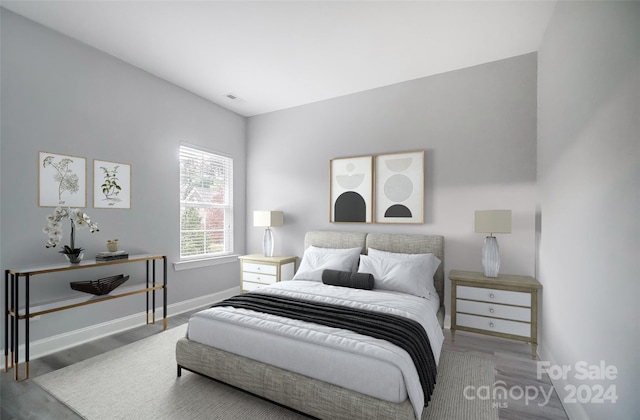 bedroom featuring wood-type flooring