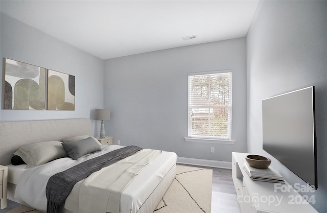 bedroom featuring light hardwood / wood-style floors