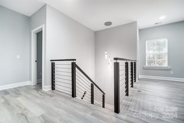 staircase with wood-type flooring