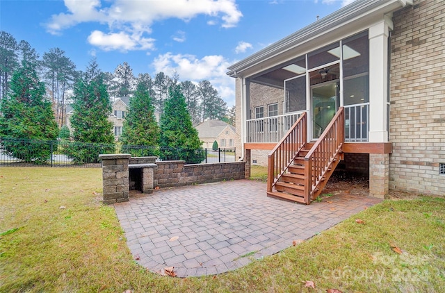 view of patio / terrace featuring a sunroom